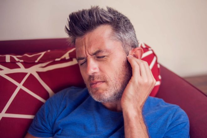 Man experiencing ear pain in Virginia.