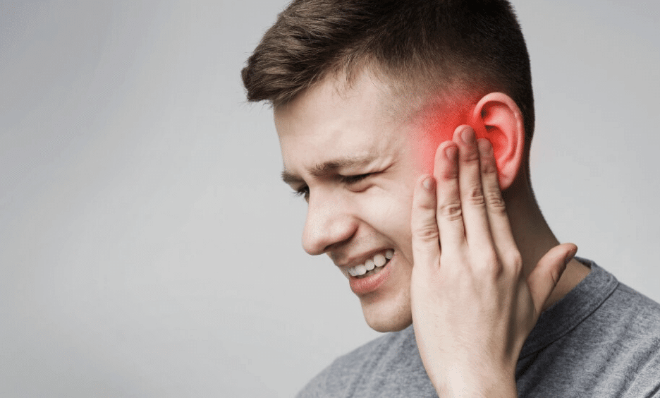 Young man with ear pain