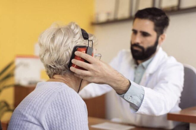 Elderly woman getting a hearing test